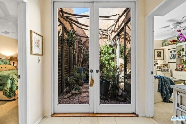 End of hallway presents the atrium with flanking guest bedrooms