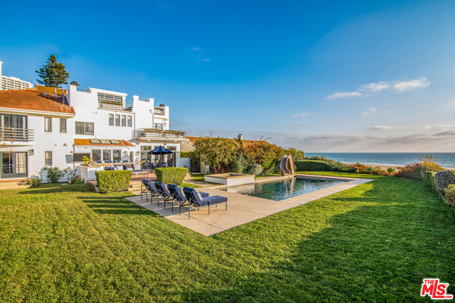 101 Ocean Way Santa Monica, California Ideally located with stunning unobstructed Pacific ocean views in the highly desirable area of Santa Monica, sits this recently remodeled contemporary estate in a class all of its own. Featuring a serene and lush resort-like backyard with a private pool, spa, bar, and built-in barbecue area, this home is perfect for entertaining. Inside offers beautiful hardwood floors, indoor-outdoor flow, large windows, and vaulted ceilings for an abundance of natural light throughout. The spacious primary suite includes a balcony with unparalleled views. A chef's kitchen, office, open family room, and dining room, and spectacular rooftop deck are just a few of the home's amazing amenities.