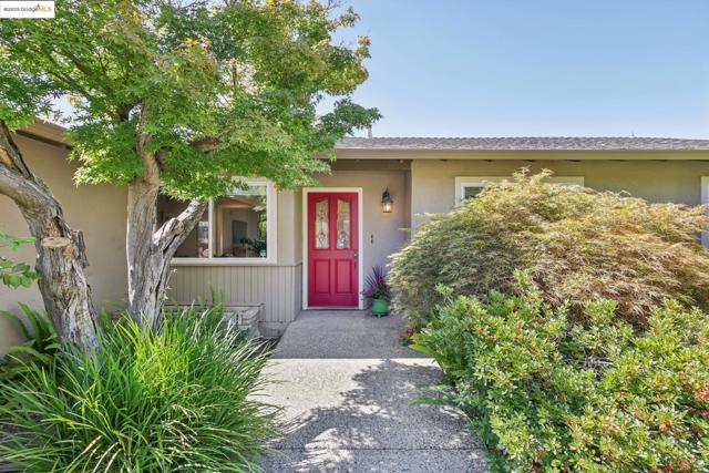 Entrance to property with stucco siding