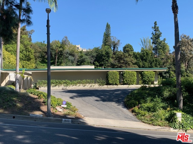 1140 LOMA VISTA Drive Beverly Hills, California Short term, 3-6 month lease! This Hal Levitt Estate, commissioned and built in 1960 by the current owners, is truly the quintessential mid-century modern! This home is available for lease fully furnished. It's ideal for short term rentals and is especially suitable for filming. There are 5 ensuite bedrooms and 6 bathrooms, in almost 5,000 sq ft on a 3/4 acre mostly flat lot. A large fully functional pool house with cabana, bedroom and full bathroom is perfect for guests and in-laws. This amazing house is great for entertaining with an open floor plan featuring a huge family room opening to the living room and dining room, all with walls of glass looking out to magnificent city views. Tremendous primary bedroom suite with sitting room and two baths & walk in closets. Fabulous contemporary kitchen with Decor and Sub Zero, an island cook top and breakfast area looking out to the sparkling pool and north/south tennis court.
