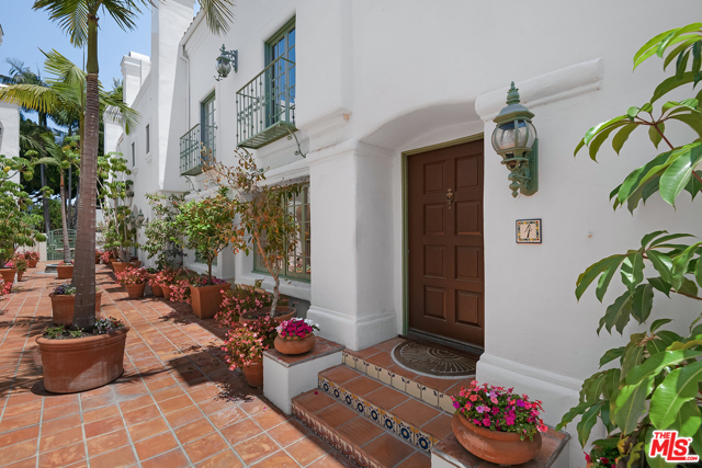 930 20Th Street 4 Santa Monica, California Beautiful Quintas Malaga, a Mediterranean- inspired privately gated complex, in idyllic Santa Monica. This newly renovated 2 bedroom, with en-suite baths (upper level #3 bedroom/den with small closet) 2.5 bath is located near world-renowned beaches, trendy shops on Montana Avenue, award-winning schools, Douglas Park and Whole Foods market. The front courtyard leads you into the unit with an open-concept layout flowing from the living room with a fireplace, to the formal dining and doorway opening onto a patio. The light and bright kitchen features quartz countertops, subway tiled back splash, abundant cabinetry and breakfast area. Chic laminate wood-like flooring creates a contemporary yet warm feeling. Retreat upstairs to the master bedroom, with a fireplace, walk-in closet and private bath offering double sinks, soaking tub and separate shower. The 2nd bedroom includes an updated en-suite bath and a walk-in closet. Convenient laundry area is nearby. Peek-a-boo ocean views can be enjoyed from one of the 2 decks off of the 3rd floor den/ bedroom with small closet. The unit can be accessed directly through the attached private two-space garage with gated driveway entrance.