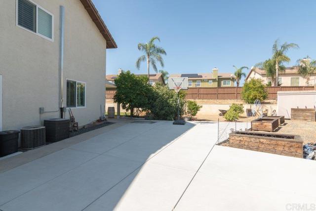 North side of home with large sport court garden a