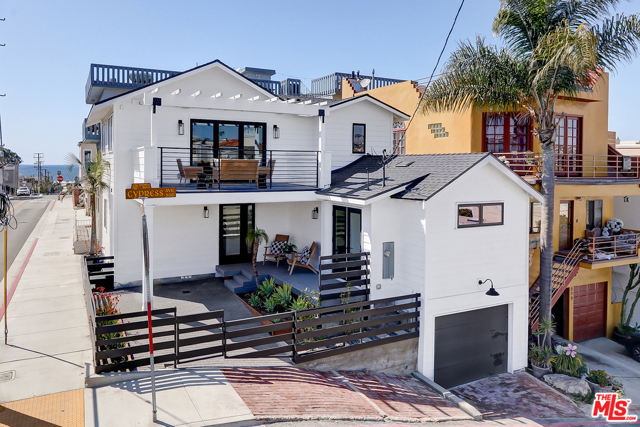 439 8Th Street Hermosa Beach, California Gorgeous Newly Updated Modern Beach House blocks from The Strand, Hermosa Pier, and with a partial ocean view. This home was extensively remodeled throughout and features 3 bedrooms and 2.5 bathrooms while boasting a bright and airy floor plan. The professional grade kitchen with large marble island, all Luxury Thermador appliances, built-in wine rack, and walk-in pantry is adjacent to the spacious living room which opens to the balcony suited perfectly for entertainment. The upstairs is complete with Dining Area, Powder Room, and Laundry. The Master Suite provides two walk-in closets with spacious bathroom and direct access to the elevated deck. The home is complete with wood flooring throughout, finished closet systems, detailed finishes, alarm wiring, speaker wiring, and heating/cooling. Be the first to enjoy this luxurious home with the fresh ocean air and vibrant coastal lifestyle of Hermosa Beach's restaurants, shops, and neighborhoods.
