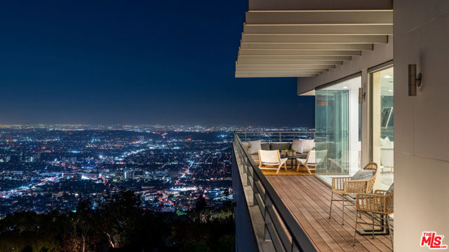 1654 BLUE JAY Way Los Angeles, California Architectural by Famed AIA Zoltan Pali with potential upside! Commanding the top of the most famous bird streets, 1654 Blue Jay Way is the height of sophisticated architecture. Every room seems to float over the lights of LA, with astounding views from Downtown to the Pacific. A mirrored alcove in the billiards room is actually a window into the swimming pool; the glass floor of a catwalk is also the ceiling of the wine cellar. Complete with gym, screening room and fully-equipped nightclub, is a re-imagining of the home of the future.
