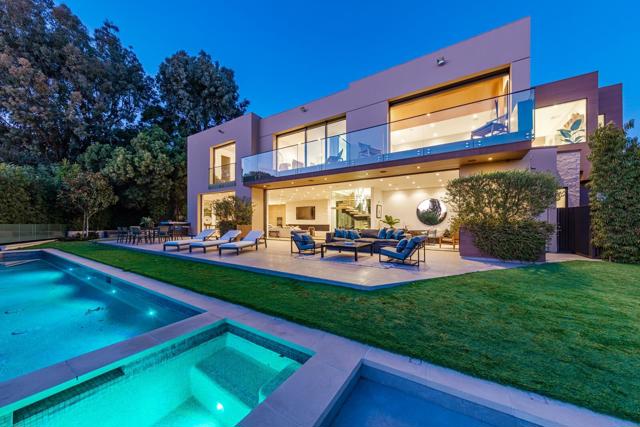 815 N Tigertail Road Los Angeles, California This stunning three-story architectural masterpiece is located on one of the most prestigious streets in Los Angeles. The moment you enter the sweeping glass entryway, you're greeted with panoramic ocean views, which truly makes this home a prized property. The bright six-bedroom home is the epitome of California indoor/outdoor living, boasting sliding glass Fleetwood doors for direct access to the expansive backyard. The top of the line Chef's kitchen features Wolf and Sub Zero appliances, Dekton countertops, and Australian Oak cabinetry. The upper level holds four en-suite bedrooms, including a lavish master, with a grand walk-in closet and an oversized bathroom equipped with a steam shower and a stand-alone bathtub overlooking the ocean. The lower level features a state-of-the-art home theater, gym, fully illuminated onyx bar, temperature-controlled wine cellar, and a Crestron home automation system.
