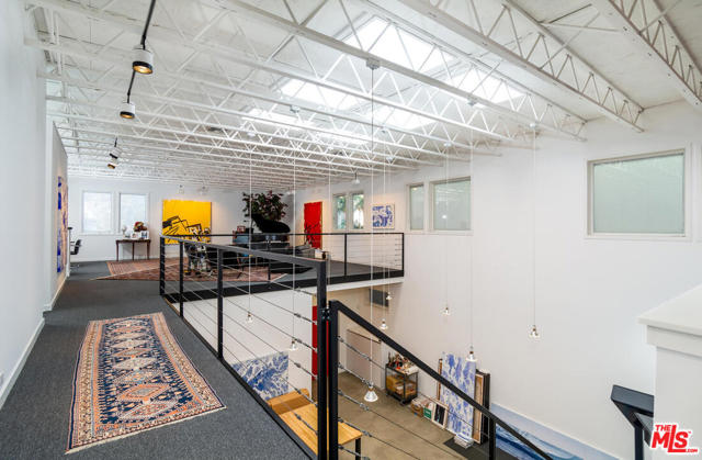 703 Milwood Avenue Venice, California Move right into this pristine property or bring your builders, architect, designer and creative spirit to reimagine this artist/loft residence. Priced to sell fast, this 4,762 sq. ft. home on a large 5,872 sq. ft. corner lot presents endless possibilities. The bones are here and the price is right. This is the perfect opportunity to invest and prosper by purchasing this pride of ownership property in a prime Venice location. This artist loft/residence is immaculately maintained with 16 carefully placed skylights that pour natural light into every room. The interior space is wide open with no bearing walls. It could easily transform into an architectural masterpiece/dream home. The house has multiple entrances with easy access to a flexible floor plan. There are separate guest quarters and music studio with a lead lined vocal booth. The 4 car garage is massive and there are 2 exterior parking spaces. Must see!