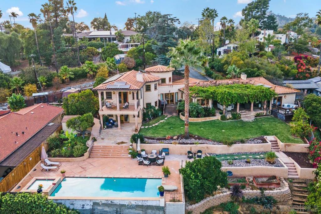 4461 Mayapan Drive La Mesa, California Welcome to your private Mt. Helix oasis with expansive 180 degree easterly views. This Mediterranean style home has the perfect outdoor space for entertaining with multiple covered patios, newly landscaped and terraced yard with a large pool and hot tub. Situated on almost 1/2 an acre with exquisite views from nearly every room, dual heating and AC, upgraded pool equipment and FULLY OWNED SOLAR. With 2 separate wings of the home as well as 2 optional bedrooms, you have the perfect opportunity for multi-generational living. At one end of the home you will find the primary suite with a gas fireplace and sitting area along with an optional bedroom. At the other end of the home there are 2 additional bedrooms and an optional bedroom / office. Hardwood flooring throughout, arched doorways and stunning wood windows give this home a classic feel. Large circular driveway surrounded by perfectly manicured landscaping with multiple mature fruit trees and automatic sprinklers. The addition to the home was made in 2012. All new septic system in 2018. 10 minute drive to Grossmont or Rancho San Diego shopping center and 1 mile from Fuerte Elementary School. Equipment: Dryer, Washer Sewer: Septic Installed Topography: ,,RSLP Frontage: Canyon