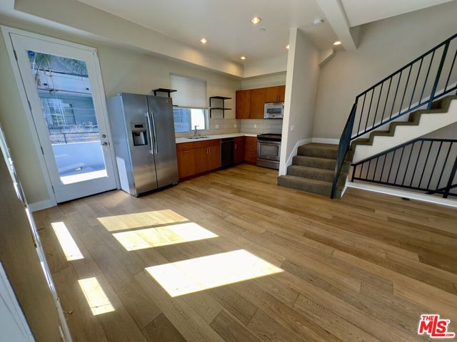 2nd Floor Living Area Facing Kitchen (Stainless Steel Appliances)