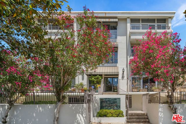 511 San Vicente Boulevard 307 Santa Monica, California Take advantage of all that Santa Monica has to offer in the historic San Vicente Courtyard District, just north of Montana. This light filled, single level penthouse offers treetop views of San Vicente with a private south facing balcony. Completely remodeled with hardwood floors throughout and a generously sized kitchen. The kitchen conveniently flows into the dining room and is equipped with stainless steel designer appliances and stone countertops. The spacious living room has a fireplace and wet bar with easy access to the balcony, making it a great space for entertaining or relaxing. The central hall floorplan offers three bedrooms, all with loads of natural light. The master has a large walk in closet, gorgeous bathroom with dual vanities. Heated swimming pool & spa and two side by side parking spots in secured garage just a few short blocks to the ocean, dining, shopping & nightlife. Do not miss this rare opportunity!