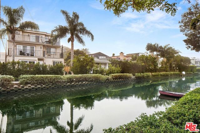 3000 Grand Canal Venice, California Trophy Canal front 5 unit Building on the famed Venice Canals. Newer construction just 2 blocks from the Ocean and minutes from famous Abbott Kinney, Marina Del Rey, Venice boardwalk and all the best Restaurants/hotspots Venice has to offer. Front 3 Story Home boasts sweeping Views of the Venice Canals and Santa Monica mountains from every level. 4BR l 4.5BA Owners unit has private elevator, front lush private garden with decks on every level, perfect for entertaining. Beautiful open chefs kitchen with Island, custom cabinets, Travertine counters, large pantry and Stainless-steel appliances throughout opening up to the Canal front garden through French doors perfect for a large Family and entertaining. Large open Living room and dining area with fireplace. Second and third levels have 2 Master suites with spacious walk-in closets, Luxurious Master bathrooms, Seating area and fireplace lead to private decks through sliding doors each with Fantastic Views down the Venice canals. Other 4 Units all comparably appointed consisting of 2x 3BR l 3BA units, and 2x 1BR l 1.5BA units. All with central A/C, heat and fireplaces. Current Gross Income of $405,120/year and Cap Rate of 4%.