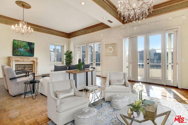 10108 EMPYREAN Way 302 Los Angeles, California Highly sought after luxurious corner PENTHOUSE at exclusive Le Parc. Rare unit layout with coveted 12-14 ft high ceilings. Stunning top floor views of city, landscaped gardens, fountains and ponds. Formal entryway leads to grand living room with fireplace and glass doors that open to breathtaking outdoor balcony. Coveted features include light oak hardwood flooring, French fireplace and French doors. Palatial formal dining room and large kitchen with breakfast area opening to quaint corner patio terrace. Lavish master suite opens to balcony and bath with 2 large walk-in closets. Large second bedroom suite and den that could be third bedroom. 24/7 guard gated security, 2 pools, 2 tennis courts, spa, clubhouse, workout facilities, 2 parking spaces, ample guest parking and storage facility. Centrally located within walking distance to restaurants, theaters, retail shops at Westfield Century City Mall, and blocks from Beverly Hills.