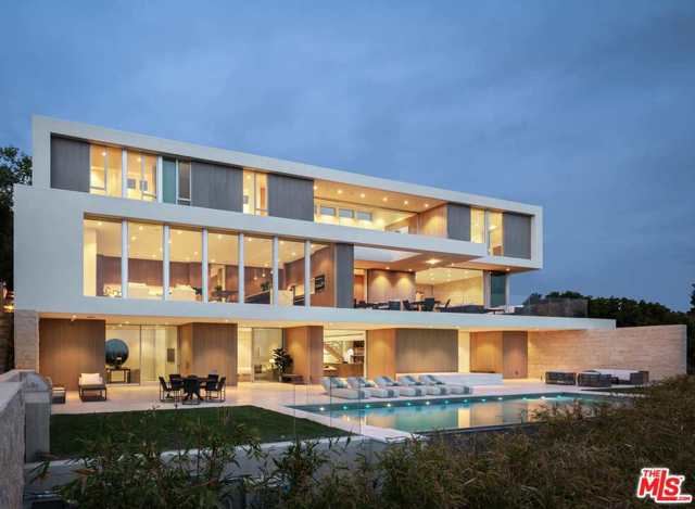1638 Casale Road Pacific Palisades, California An evolution of Modernist Architecture designed with both purpose and intention to create a sublime experience of space and light. This Woods+Dangaren 8 bed 11 bath home + detached guest house is perched high above the Pacific Ocean in the highly coveted Upper Riviera. Majestic 180 coastline + city views are revealed through sliding walls of glass and framed openings to seamlessly connect indoor and outdoor spaces. The main floor introduces warm, organic materials to the experience with Duchateau flooring, custom casework, rift-oak paneling, and rough-hewn limestone to the living and dining areas. An open chefs kitchen with expansive views is complete with Miele appliances, Calacatta stone island, secondary kitchen, and open concept great room. Upstairs, beams of daylight diffuse through the transparent 3 story staircase as kinetic art. Skylights and glass envelop 3 ocean-view bedrooms and a primary suite with floors of radiant heat, fireplace, and pocketing Fleetwood doors that expose a uniquely private and serene outdoor deck, blurring the line between indoors and out. The lower infinity pool + grand spa level is complete with full kitchen, reflecting pond, 2 ensuite bedrooms, gym, office, and theater. The glass sliders from each room provide access to an outdoor environment that is quietly luxurious, elegantly fluid, and ideal for entertaining.
