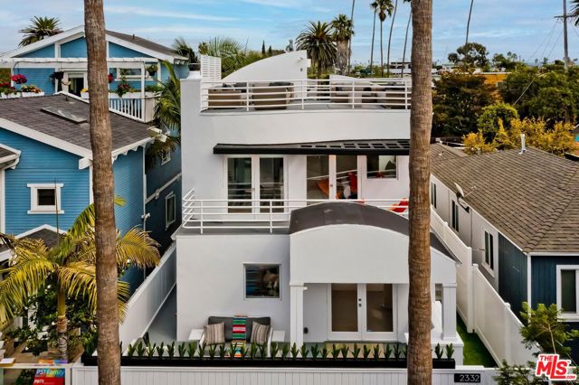 2332 Ocean Avenue Venice, California Designed by local Venice architect, Toby Watson, in 1991 w/recent remodels by Studio MacDonald Libit AIA, Ocean House is a gated oasis adjacent to the Venice canals & just blocks from the beach & Abbot Kinney. The bright & light 3-bed, 2 & 1/2 bath contemporary home includes an open concept first floor that is perfect for entertaining w/direct access to both the cozy front deck & sunny back yard. The gourmet kitchen has top of the line appliances, ample cabinet space & a large center island. Upstairs are 3 generous bedrooms. The primary has a wonderful balcony, a well-designed custom closet system & a luxurious bathroom w/heated floors, a couples shower & a soaking tub. The newly remodeled guest bath includes a steam shower & heated floors. A large roof deck gives yet another private outdoor space to relax or entertain w/ sunset views. The separate 2-car garage w/loft provides possibilities for an office/bonus space/ADU. This truly is the best of Southern California beach living.
