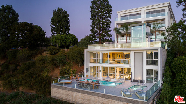 2391 Roscomare Road Los Angeles, California ONE BEL AIR, a premier new construction 10 unit luxury building, the only one of its kind located in scenic upper Bel Air, offering 'home alternative' residences in one of Los Angeles' most sought after neighborhoods. A NEW $16.6M ASSUMABLE LOAN HAS BEEN PLACED ON THE PROPERTY AT 3.77%, FIXED FOR 10 YEARS (APPROXIMATELY 9 YEARS LEFT), INTEREST ONLY AND MUST BE ASSUMED WITH PURCHASE. Breathtaking ocean and canyon views beautifully combine nature, serenity and modern luxury. Sleek architecture and sophisticated design, finishes and fixtures are set amidst a lush mountainous back drop perfect for taking in dramatic sunsets. Equipped with a gym, lounge, spacious viewing deck, pool and pool deck, secured entry and parking garage. This iconic offering brings refined, multi-unit, luxe living to the hills.