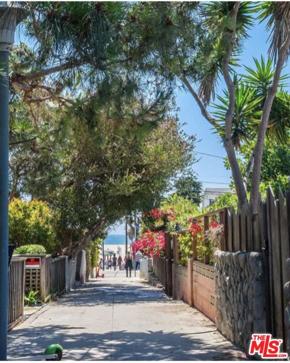 23 Sunset Avenue Venice, California New adjusted price !! You will not get this close to the ocean at this new offering its a once in a life time find. Hello Pacific Ocean! It is always about the location! Welcome to this sweet spot on a nostalgic Venice Beach walk street. Four doors from speedway where you can touch the sand. This home is located very close to Rose which is the approx. Santa Monica & Venice Beach border. The home offers ocean views from the large front deck, 5 beds or 4/office, 5 bathrooms, 2581 sf and 3674 sf lot., Murphy bed in office, LG side by side washer and dryer, three (3) skylights, three (3) storage areas in basement and garage, doggy run east side of the property and outdoor beach shower on west side of the property. It was remodeled in 2004 approx. 1,000 sf addition. Expanded the kitchen, added master bed with master bath, two additional bedrooms & baths added upstairs, laundry room and garage. With some TLC this home could be further updated and reimagined with endless possibilities.
