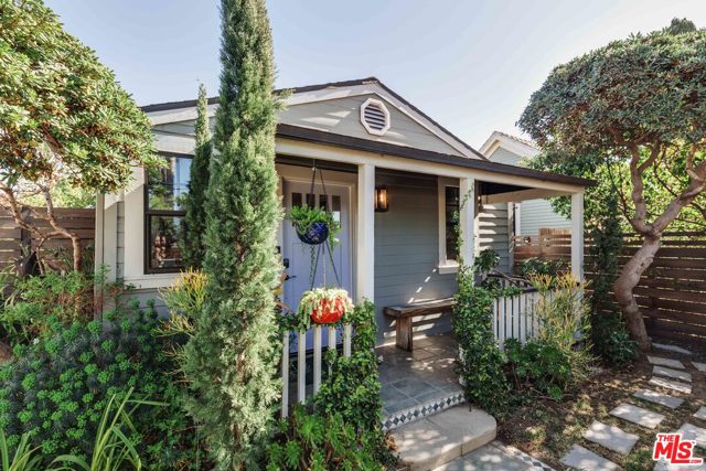 1016 Oakwood Avenue Venice, California Tucked away behind a privacy fence is an adorable 1905 porch front craftsman cottage residing in a magical garden. The front house consists of 2 beds/1 bath and an office. It has been fully remodeled and features a Dutch blue open kitchen with quality appliances. French doors lead out to a private patio. The back unit is equally well appointed featuring a kitchen/dining room, bath + living room. The large master opens onto its own enclosed garden. Perfect for an owner user or generate income from one or both units. A short distance to shops and dining on Abbot Kinney, the Venice Whole Foods Market and the beach. The property is sited across from a grassy field, perfect for exercising yourself or your dog.