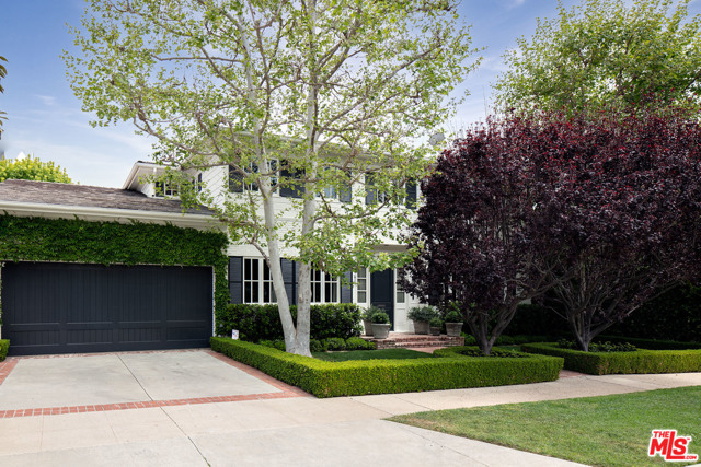 608 Ocampo Drive Pacific Palisades, California Much admired, extensively remodeled two story Traditional Gem in the extremely desirable Huntington Palisades--close to the Village, Palisades Recreation Center and the beach. Handsome street presence and lush, mature landscaping lead to open floor plan, well-proportioned, sun-filled spaces with rich hardwood floors, refined Traditional detailing, paneled walls and custom millwork throughout. Double height entry leads to inviting formal living room with fireplace, formal dining room with wainscoting and library with extensive built-ins. Fabulous grand scale "great room" consisting of large family area, casual dining area and cook's kitchen opens through French doors to bluestone patios with retractable awning, lawn, gardens and pool. 5 bedrooms, 5 1/2 baths including spacious primary suite with generous bath and closet. A truly exceptional and rare offering in the most prime Pacific Palisades location.