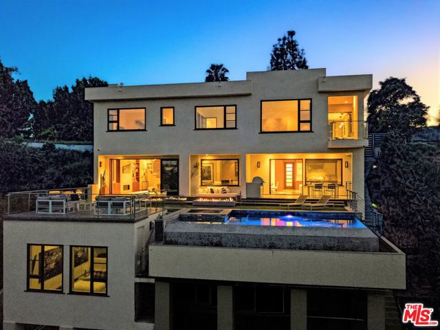 1018 STRADELLA Road Los Angeles, California Coveted Stradella Road, Bel-Air. Opportunity awaits! Offering includes new land acquisition to the north (Cumulative lot apx 29,184sf) + Approval ready architectural plans for Guest House/ADU addition all included with the purchase price. Existing 2013 sexy turnkey modern. Smart home system by Control 4. Formal Living room converts into Home Theater upon command. Pocketing walls of glass reveal an endless infinity pool w/ extraordinary view of veranda, dining loggia & entertaining deck. Perfect Owner user or a phenomenal development opportunity awaits. There is a vacant parcel adjacent next door as well totaling apx 50,000sf of contiguous prime west Bel Air land with Awesome DTLA views. Move right in, or add on, or re-develop 3 contiguous lots into one of the most exciting new construction opportunities perfectly positioned with jetliner views. Surrounded by landmark $20M + estates redefining Stradella Road.