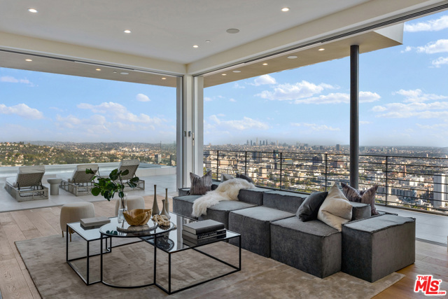 7007 Los Tilos Road Los Angeles, California The epitome of a Hollywood Hills view home. Breathtaking jetliner sights enveloped by a modern, completely remodeled two-story residence throned atop its own nearly 1-acre knoll. Up a long, private driveway stands the now 3 bedroom and 4 bath ensemble. Unobstructed panoramas extending from the Hollywood sign to the Pacific are embraced from every room in the house through floor-to-ceiling glass and stainless-steel windows and expansive warp-around terraces, offering some of the most compelling views in the city. Whether in the capacious living room highlighted by a romantic fireplace, in the formal dining room or by the pool, a picturesque portrait of LA's landscape is always on demand. Dotted with palms and finished with a powder room, office and a three-car garage, 7007 is a home above the rest.