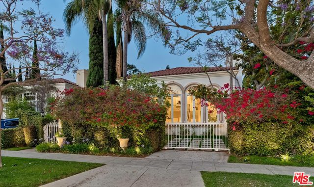 106 N Oakhurst Drive Beverly Hills, California Remarkable gated 1990-built 2sty Contemporary Mediterranean estate of voluminous scale. Sunlit rooms featuring marble and wood floors, French doors, and high ceilings. Courtyard-style entry opens to a dramatic 2sty foyer and baronial 2sty living room with bar. Cook's center-isle granite kitchen with endless storage, a huge breakfast room, and an attached mammoth family room. True indoor/outdoor entertainment flow with banks of French doors opening to upstairs balconies and the main level grounds with patios, pool, mature foliage. 4 bedrooms upstairs with closets galore and maid's quarters downstairs. Grand primary bedroom suite features fireplace, balcony, giant walk-in, big bathroom with a private view terrace. 2 other upstairs bedrooms contain private balconies. Gated front parking space and a direct-access 2 car rear garage for privacy and security. Illustrating the epitome of a lavish lifestyle, this wonderful home affords a flexible layout for one or many and is sited within moments from Beverly Hills' renowned Golden Triangle and the best amenities of the Westside.