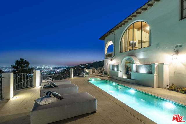 1924 N Wattles Drive Los Angeles, California This newer construction Mediterranean compound perched just above the Sunset Strip features jetliner views, a large front and back yard, pool, movie theater, fitness room, recreation room, attached guest house, 6 car garage, security gates and more. Situated at the end of a prestigious private street with great proximity to hiking trails, this Hollywood Hills oasis epitomizes sophisticated all inclusive living. Enjoy a poolside barbecue overlooking the entire city of LA and Pacific Ocean, run your business out of the guesthouse, then retreat to the private theater for a late night movie. 1924 Wattles Dr is an elite residence for your most discerning buyers.