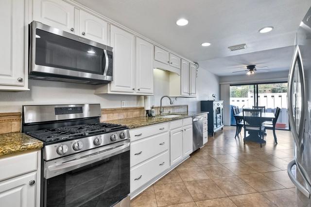 Gorgeous kitchen w/ newer stainless steel appliances, including an upgraded GAS range/oven ...