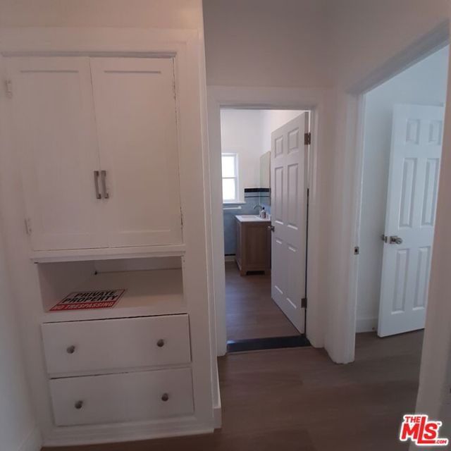 Hallway to bedroom + bathrooms