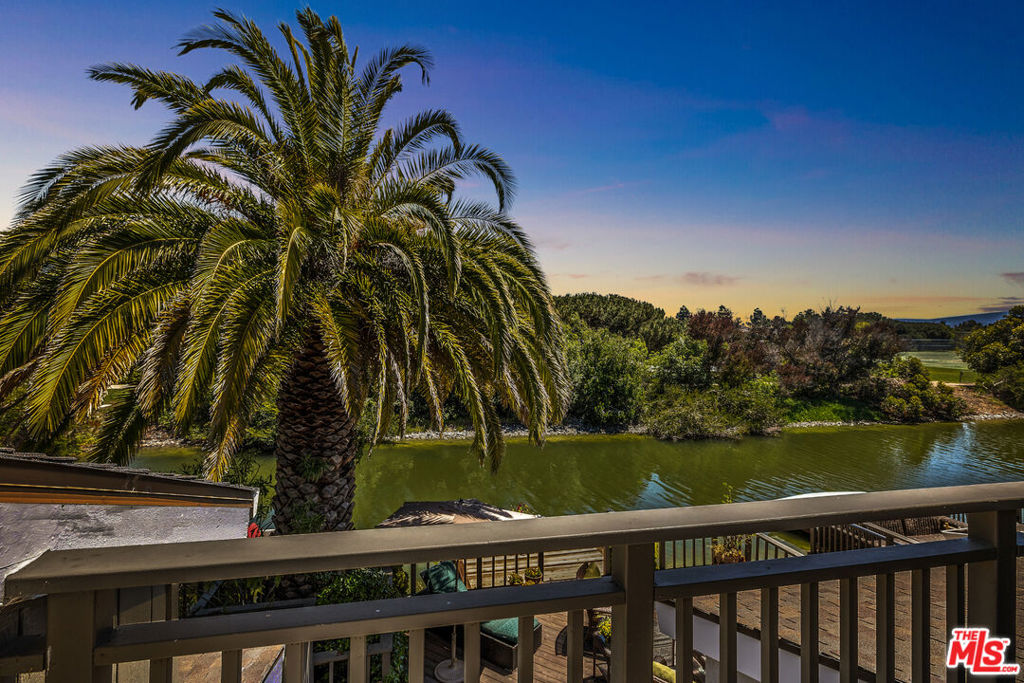 This beautifully newly renovated townhome features vaulted ceilings, a stunning entryway and  its own dock. It is quiet and located in one of the best communities on the San Francisco peninsula. Waterways for electric boats and athletic activities abound. HOA dues include a community pool and tennis courts. A local park with a beach is within close proximity. Watch collegiate sculling teams practice on the wide waterway. The kitchen features all new cabinetry, Calcutta gold quartz waterfall counter tops, a Blanco wide sink with Kohler faucet/accessories, a new Samsung range and dishwasher and a breakfast area that opens out to the deck. The primary bedroom is en suite with a huge bathroom area and is stunning with vaulted ceilings, York wallpaper and a shiplap accent wall with a warming electric fireplace and stunning chandelier plus a TV mounting insert in the ship lap wall. The shower room feature a new signature toilet that can utilize a cleansing bidet. The secondary bedroom, also ensuite, features a ship lap wall and newer bathroom with a James Martin Vanity. EASY TO ADD A SHOWER ON TO  the powder room which is next to the 3rd bedroom located on the entry level floor which has its own fireplace. Additional upgrades include a new redwood dock, all new outlets, switches, dimmers, new Kohler medicine cabinets, new bathroom framed mirrors, fresh paint, new flooring and quality carpet in the bedrooms, high end chandeliers, and candy glass sconces, all new door handles and hinges plus a new front door lock and garage door entry key pad lock. The rooms are large with plenty of storage to include a large attic with a pull down ladder in the garage. Welcome home.