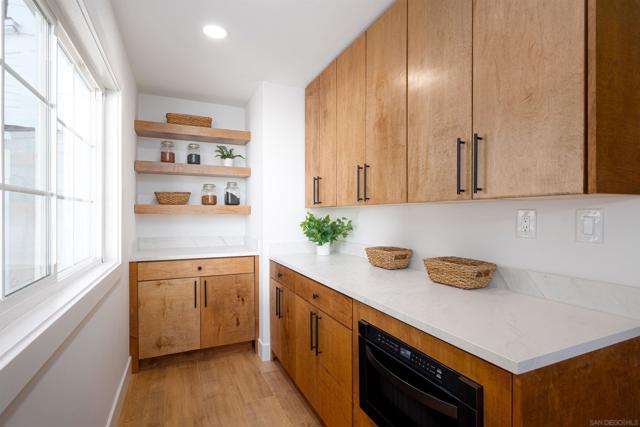 Hidden pantry area with in cabinet drawer Microwave