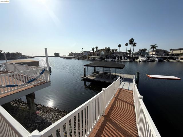 Dock area featuring a water view