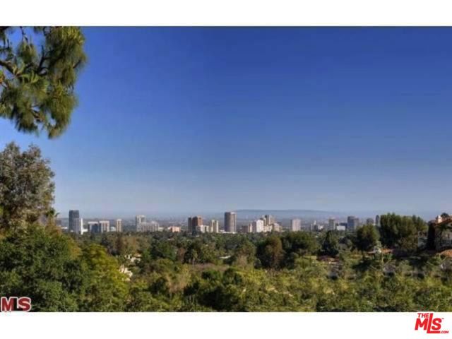677 Nimes Road Los Angeles, California Located along the famous "Billionaires Row" sits this brand new gorgeous modern oasis, ready to be completed with the buyers taste in finishes. This unique property offers 320 feet of frontage on Nimes Road and is surrounded by some of the most expensive real estate in the world. Extensive foundation work including 105 piles have created an enormous deck with amazing city views from every corner. All rough construction including framing, electrical, plumbing and HVAC of this giant three-story mansion is done. The extraordinary trophy estate offers a spacious master suite with his and hers separate bathrooms and closets, 5 en-suite bedrooms, 9 bathrooms, grand living room, multiple family rooms, gorgeous dining areas, chef's kitchens, media room, indoor spa, wet and dry sauna, gym, elevator, many decks with entertainers areas, outdoor infinity swimming pool, indoor and outdoor jacuzzi, water features and maids quarters with separate entrance. Owner is willing to carry paper.