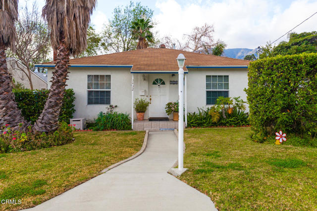 3432 Prospect Avenue La Crescenta, California This wonderfully comfortable 3 Bedroom, 2 Bath is located on a quiet No Outlet street in a desirable area of La Crescenta. It is located within walking distance to a Blue Ribbon Elementary School and convenient Foothill Blvd.When you open the door you will be welcome with shiny wood floors and inviting Living Room with two banks of newer windows framing the lovely fireplace and mantel. A roomy dining area adjacent to the kitchen is accented with newer windows and popular wood floors. The large updated kitchen has abundant cabinetry with some glass panel cabinets and custom wine cabinet. Lots of counter space and tile floors with large pantry. There is also space for a small two seat table and chairs for morning coffee or tea. A beautiful primary Bedroom with warm wood floors, newer window , walk-in closet with small full updated bath. Second Bedroom is rich with wood floors and two newer windows, closet and ceiling fan. Third Bedroom is currently used as a convertible den and has a closet and ceiling fan with built-in cabinets and drawers. A stream of soft light fills the room from a solar tube from the ceiling. The second bathroom has been tastefully updated and is nice and spacious.The yard will cinch it for you. The covered patio will keep you shaded from the summer sun or sit under the bougainvillea covered arbor and enjoy the backyard. Pretty shade tree also makes for an even more attractive yard. There is a storage shed for yard tools and lots of extra storage under the house.Additionally, approximately there is a 400 sq.ft garage that has been converted into a room without benefit of permit. There is currently a very cooperative tenant. *Please treat him with the greatest of respect.*. There is a brick berm that was built in front of the garage door to prevent the garage door from being opened. Side door entrance from yard. Home shows 1327 sq.ft. Per assessor, but Seller says permit was pulled for 150 sq.ft kitchen addition. Buyer to verify information to their satisfaction. PLEASE READ SHOWING INSTRUCTIONS CAREFULLY. Thank You!