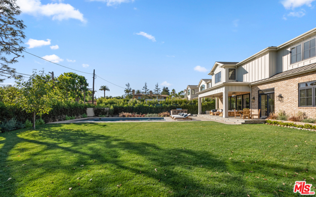 12730 Hanover Street Los Angeles, California Located in prestigious Brentwood Park, this beautiful brand new construction estate features the highest caliber of finishes, lush and spacious grounds and grand-scale living spaces that distinguish it among the neighborhoods finest homes. Beyond a secure and private motor court, doors open to a foyer, leading to a living room with a fireplace, study and formal dining room with butlers pantry to a phenomenal open chefs kitchen and great room with a bar, fireplace & sliding pocket doors to the grounds beyond. Upstairs holds a living area, 5 ensuite bedrooms with walk-in closets, including a gorgeous master bedroom with fireplace, exquisite dual showroom closets and spacious bathroom. An expansive lower level holds 2 ensuite bedrooms, a theatre, gym, wine room & entertainers dream bar. An incredible backyard features a pool, spa and sprawling lawn. An elevator, Savant system and 3-car auto gallery complete the offering.