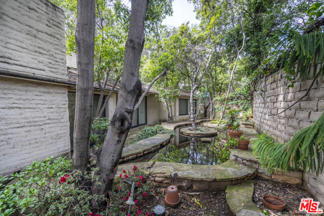 1505 Old Oak Road Los Angeles, California Welcome to arguably the largest most beautiful setting in Brentwood's equestrian Sullivan Canyon. This property consists of a classic ranch house, guest house, stables, pool, sport court, separate dance studio and separate office. The main residence is over 7,000 square feet and the lot is over one and a half acres. The setting is truly amazing. Restore this property and make it an iconic westside trophy property. Easy to show.
