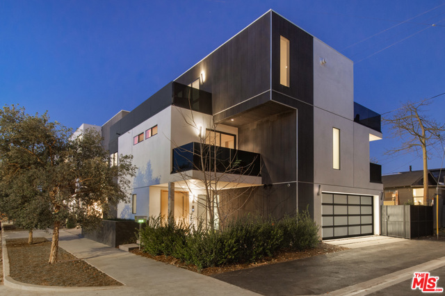 1902 Penmar Avenue Venice, California THE ENCLAVE at Penmar is an architecturally modern collection of three coastal homes located in Venice. 1902 Penmar is one of three exclusive residences of the collection and is graced with custom architectural details and deluxe flourishes throughout. This newly constructed contemporary residence offers a thoughtful floor plan boasting abundant natural light, peaceful views, and dual balconies for indoor-outdoor living in Venice. Arrive via a modern oak pivot door where a bright, spacious family room opens to a patio adorned with an eco-friendly lawn and gentle landscaping. A floating staircase adds dramatic flair and frames a charming alcove seating area. The upper third floor showcases a brilliant living room with a linear fireplace clad in Venetian plaster, and a formal dining room with a large picture window and wall of glass doors to the sizable balcony. The kitchen boasts bespoke Italian design with Fisher & Paykel appliance suite, walk-in pantry, and built-in shelving. 1902 Penmar elevates the experience of technology driven design and uniquely offers additional upgrades including a pneumatic elevator, Italian designer closet system, security system, sound system, and Savant Smart Home Automation.
