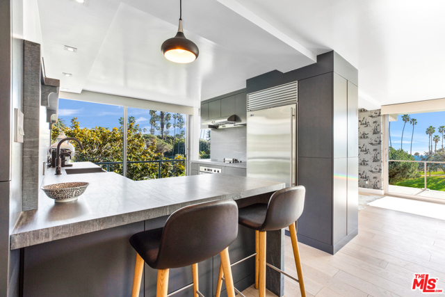 535 OCEAN Avenue 3B Santa Monica, California This luxury condo, in the prestigious Oceanaire building, is designed by world-renowned architect A. Quincy Jones. In the most desirable corner of the building, it boasts unobstructed ocean, mountain, and park views from Pales Verdes to Malibu. This gorgeous residence has been impeccably remodeled, featuring an open floor plan, wood floors, floor to ceiling Fleetwood sliding doors, a state of the art kitchen with marble countertops, Sub-Zero and Bosch stainless steel appliances, all opening to a sprawling living area with a built-in media unit and bookshelves. During the day, the dining room is flooded with natural light. By twilight, dinners are enjoyed by watching the sunsets over the Ocean. A wraparound balcony creates a wonderful indoor/outdoor flow that epitomizes the California lifestyle. En suite laundry with Bosch washer and dryer, two designated parking spaces, and storage. Building amenities include 24-hour concierge/security, Zen garden, fitness center, and conference room.