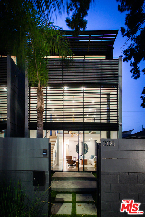 305 Venice Way Venice, California Modern living awaits in this architectural new construction home, situated seconds away from Abbot Kinney, Windward Circle, and the Beach. Tucked behind gates for maximum privacy, this 4 level property offers the epitome in design and materials that include polished concrete, oak flooring, and exposed steelwork. An abundance of natural light awaits inside, with soaring 18ft ceilings in the entry and walls of glass throughout. Enjoy gallery-style walls, a gourmet kitchen with professional appliances and custom cabinetry, and smart home technology including Control4 and Nest. This home boasts 3 bedrooms, including a master with a private balcony and spa-like en-suite bathroom, 2 generous guest suites, and attached 2-car garage. A stunning roof deck offers the ultimate space to relax, with custom awnings and 360-degree views of the mountains and Getty Museum welcome home!