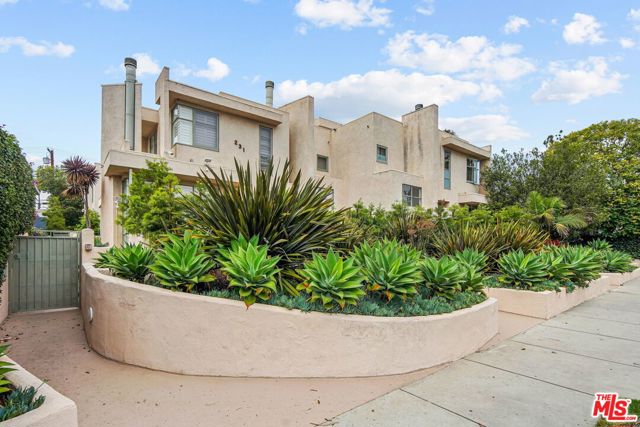 231 Bay Street 4 Santa Monica, California Less than a block from the excitement of Main Street, and a couple blocks from one of the best stretches of Santa Monica coast, this cool contemporary townhome offers the best of beach living. Only 5 units make up this community of unique modern homes designed by architect William D. Brantley. This multilevel architectural feels like a house with private two-car garage with direct entry. Awesome roof deck offers peek-a-boo ocean view. Tons of windows and skylights and vaulted ceilings invite an abundance of natural light throughout. Bright, and airy living room with fireplace and another private patio. Sensational Master suite with fireplace, large walk-in closet, and spacious bathroom. Amazing opportunity in Ocean Park!