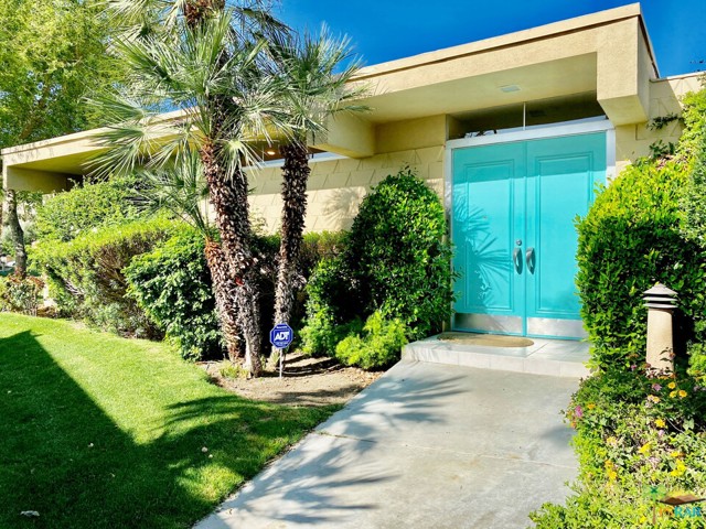 330 Desert Lakes Drive Palm Springs, California South-facing Richard Harrison designed mid-century 3 bedroom/3 bathroom attached home with open floor plan of 2,114 SF, tall ceilings with walls of glass/sliders showcase panoramic views of 6th & 7th fairways & southern mountains, living room features a gas fireplace flanked by custom built-in cabinetry backed with mirrors and lighted glass shelving, master your bartending skills at the swank sunken wet bar with seating for four faces private, sunny atrium courtyard patio, clerestory windows in kitchen and above double front door entry, master bedroom has been expanded out to terrace with additional seating area, bathrooms have been updated, adjacent to pool and has a single parking space in shared double garage with storage cabinets. Known as "The Gem of the Desert," 7 Lakes is a 24/7 guard gated private golf community with a Ted Robinson designed executive 18 hole (par 58) golf course, 15 fabulous pools/spas most with Ramadas, kitchenettes, restrooms, showers, William Cody designed clubhouse with dining room, bar/lounge, outdoor terrace overlooks lake with waterfall & fountain, golf pro, pro shop, putting greens, and, of course, 7 lakes!
