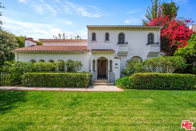 617 N Linden Drive Beverly Hills, California Rare opportunity in the prestigious Beverly Hills flats. This 12,105 SF lot includes a 4154 SF quintessential Mediterranean-style main house with 6 bedrooms and 4.5 baths, plus a coveted, permitted 1300 SF 2-story guest house with full kitchen and large rec room. The elegant main house features timeless arch and pillar designs, vaulted ceilings in living room and den, spacious windows for natural sunlight, sliding glass doors for indoor/outdoor living, formal dining room overlooking pool and garden, well-equipped kitchen with breakfast nook, home office with built-ins and generous bedrooms. The secluded backyard provides a tranquil and private setting for al fresco living with lush landscaping, bright florals, soaring trees and a dazzling pool. This classic main home plus full guest house compound is located on a serene, tree-lined street, far from traffic, a 5 minute walk to El Rodeo Elementary School and a few blocks from Rodeo Drive shops and Beverly Hills restaurants and entertainment. A gem in a world-class locale, the possibilities are limited only by imagination.
