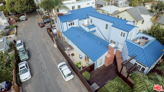 653 marine Street Santa Monica, California Ocean Park Jewel. Rare opportunity to own a trophy Santa Monica NON-RENT CONTROL multi unit property six blocks from beach. This unique resort style complex features an architectural metal roof, redwood fences, decks & trellis, (4) car earthquake retrofitted covered garage, landscaped with Bermuda grass & beautiful palm trees. Each of the units have been individually customized. The single-family residence (1+1) has custom kitchen, maple cabinets, Viking stove, Subzero refrig/freezer, closets, maple hardwood floors, maple bookshelves, 2 pvt decks, French doors, vaulted ceiling, stone wood burning fireplace, pvt grass yard. The (2+2) townhouse has custom kitchen, stone tiled bathrooms, 3 pvt decks, French doors, office space, hwd floors, vaulted ceiling & pvt grass yard. The upper rear unit (2+1) has custom bathroom, vaulted ceiling, hw floors, unbelievable natural light, 2 pvt sundecks. Studio space w/ custom bath, Spanish tile floors, french doors, pvt entrance. Do not disturb tenants, building fully occupied. CALL AGENT for vacancies options at COE.