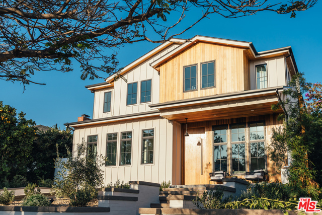 1126 Monument Street Pacific Palisades, California With the utmost attention to detail and immaculate design, this new construction modern farmhouse is a one-of-a-kind find just a stone's throw away from the Village. The moment you step foot into the home, you will be greeted by the thoughtful floor plan, beautiful wood detailing, exceptional use of mixed materials, and striking fixtures. The main level features a dining room, living room, butlers pantry, elevator, and statement kitchen with breakfast area. The indoor space opens up to the private yard with covered seating area, pool, spa, and BBQ. Upstairs you will find 4 en-suite bedrooms, including the master suite with fireplace, sitting area, balcony, and a 5-star master bath. The breathtaking rooftop deck features ocean views, built-in seating, and a spacious entertaining area. The lower level is filled out with a movie theatre, game room, wine cellar, 5th en-suite bedroom, and 2nd laundry room in addition to garage access. A true dream home for those who appreciate perfection!
