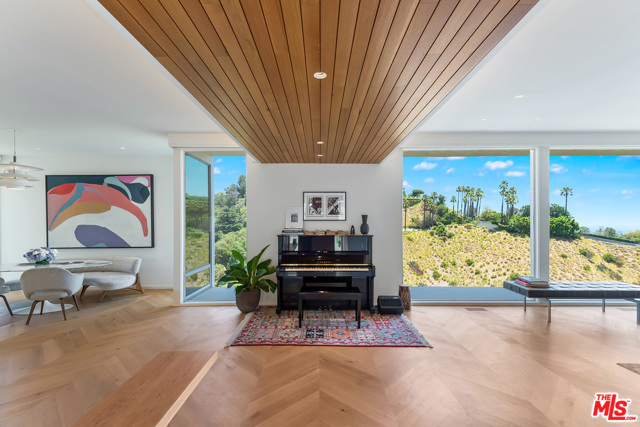 9354 Readcrest Drive Beverly Hills, California Welcome to Skycrest, a magnificent mid-century modern home sitting on one of the finest Crest streets above Beverly Hills. This stunning architectural home was designed by renowned architects, Robert Tyron, AIA & George Foy, AIA in 1961. Impeccably remodeled by the current owner, the home has been updated with high-end materials throughout - the additions of added privacy features and a bonus room under the home. The open floor plan is framed by glass walls that showcase the explosive views from the canyon to the ocean. Sophisticated design and materials throughout the home, including herringbone wood floors, Carrara marble in the kitchen and bathrooms, electronic window coverings, and Italian appliances. Home features two large principal suites, multiple fireplaces, a wraparound patio, and a direct access double garage. Upstairs den is easily converted to a third bedroom. State-of-the-art security alarm system with cameras and technology throughout. This secluded retreat is located on a highly sought after street, just minutes away from the Beverly Hills Hotel, Greystone Mansion, restaurants and shopping - not to be missed!