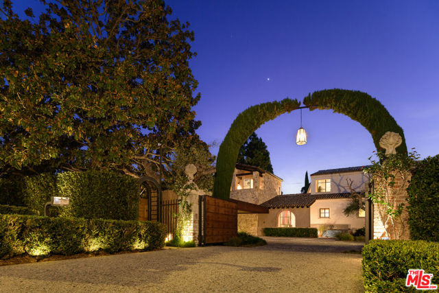 976 N Alpine Drive Beverly Hills, California Designed by renowned architects Luis Ortega and Jose Fernandez, this custom-built significant Beverly Hills masterpiece showcases an interplay of varying roof angles combined with natural stone to give the exterior a monumental presence. Exquisite materials from the rustic wood beams and steel-cased windows to the outdoor patios and decks create areas for entertaining and views of the property and gardens. A glass foyer leads to earth tones of stone, wood, steel, and glass. An open floor plan creates a sense of volume and serves as an extension of the exterior setting and expansive pool deck and cabana. The main level offers a large formal dining room, an office/library, and a complete guest suite. Also on the main level is the primary bedroom suite with vaulted ceilings, floor-to-ceiling windows, and a two-bathroom suite with a spacious marble shower, a large sitting bath, and his & hers walk-in closets. The custom chefs kitchen features Miele, Sub-Zero, and Kuppersbusch appliances that lead to a dining and living area that opens to the outdoors. Upstairs you'll find two guest casitas with the option for an office or home gym and an observation deck overlooking Beverly Hills and city views.
