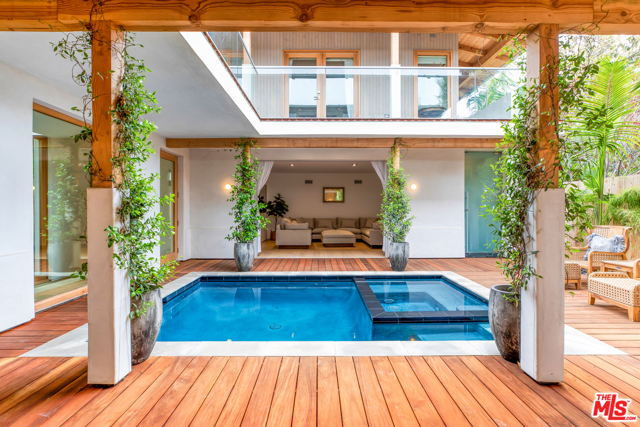 632 Brooks Avenue Venice, California Situated just steps from Abbot Kinney and a short stroll to Lincoln and the beach is this Balinese-style Oasis. Gated, hedged, and completely private, this Venice compound features 5BR/4.5BA, with sleek, open & airy interiors designed for maximum indoor/outdoor Southern California living. The home's indoor/outdoor areas include a state-of-the art kitchen, spacious family/media room, and living room with floor-to-ceiling glass Fleetwood pocket doors that flow out to the covered veranda. The tropically inspired residence also features a central courtyard, complete with pool & spa, as well as 2000 SF of lanai decking which nearly doubles your usable outdoor living space. Floating above the pool area is the impressive master suite with fireplace, large walk-in closet, and beautiful stone bath, all opening onto the wrap-around upper level lanai. The property is gated and surrounded by a perimeter of mature Kentia Palms and lush Ficus hedging. Additional features include brand new imported white oak floors, natural stone slab baths, laundry room, gated entry, two-car garage + two-car off-street parking, plus gated alley access. Close to all of the best Westside restaurants and shopping, this truly is the best house in Venice.