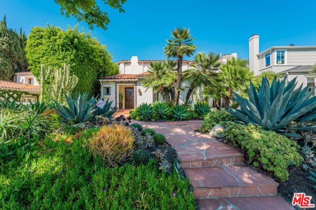 466 S Camden Drive Beverly Hills, California This rare remodeled Spanish architecture is an absolute sight to see. This cool California Spanish seamlessly delivers the confluence of original architectural details and modern amenities.The perfect center hall floor plan comes with a large step down living room featuring beamed ceiling and fireplace. Expansive formal dining room with French doors opening to the covered patio and backyard. Gourmet eat-in kitchen w/Viking appliances. Entertainment room with temperature controlled wine cellar. Master suite and 2 additional generous sized en-suite bedrooms upstairs. The attached, spacious guest house with murphy bed opens to the large private backyard and large pool surrounded by tall hedges. This is a smart home which includes a built-in sound system throughout the home, Crestron Smart Home technology, 5 zones of central heat and air using Nest thermostats, and an alarm system. The property is in the BHUSD school district.