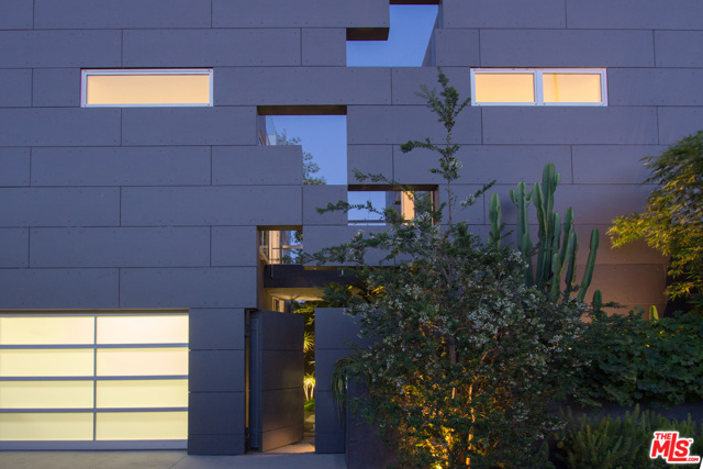 1201 CABRILLO Avenue Venice, California Featured in Architectural Digest, experience the bold design of this modern compound moments from the epicenter of Abbot Kinney. Minimalist architecture defines this home with an open living plan and a custom Bulthaup kitchen. Walls of glass merge the indoors and out, taking full advantage of the sun & sea breezes. A floating steel-and-walnut stair beckons you to an expansive rooftop deck - complete with fireplace, kitchen, hot tub and lounge areas. Exquisite master suite is simple and elegant, with custom his & hers closets, a glass-panel steam shower and a freestanding soaking tub with lush views of the landscape and ocean sky. A terrarium courtyard splits the two distinct structures on the property, with an overhead bridge joining the buildings. High ceilings, abundant natural light, refined in detail and finish, this dynamic environment offers complete privacy in the heart of Venice.