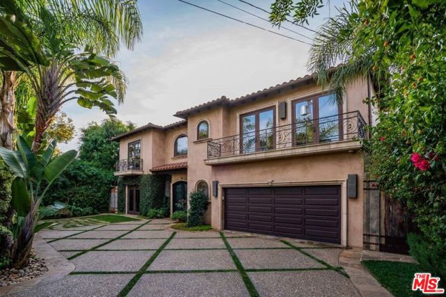 249 S WESTGATE Avenue Los Angeles, California Custom-built for a Super Bowl Champion & two-time Emmy winner, this Mediterranean-style villa is a warm & inviting retreat with open floor plans, soaring height, large-scale rooms & indoor/outdoor amenities fit for a 5-star resort. Upon entering the gated & private courtyard, a pair of stately doors welcome you into the entry hall featuring a curved staircase with intricate railings and skylight. The majestic dining room is ideal for elegant dinner parties. Wall-to-wall French doors bring in abundant natural light & direct access to the lush backyard. The primary bedroom suite offers spa-like amenities, including two fireplaces, a jetted tub, steam shower, walk-in-closets & balconies overlooking the lap pool and waterfalls. Other features include chefs kitchen, custom designer finishes, en-suite bedrooms, elevator, theatre, wet bar, outdoor kitchen, fire pit, two laundry rooms & ample storage. It is located less than a mile from high-end shopping districts in coveted Brentwood.
