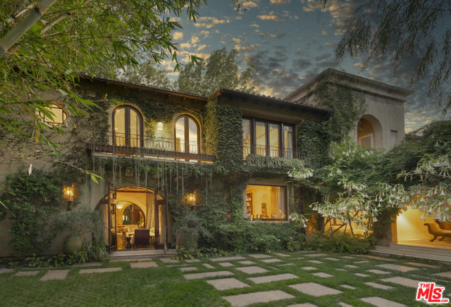 715 N Alpine Drive Beverly Hills, California Through hand-carved gates, this European Villa commands a .53-acre lot and delivers maximum Beverly Hills pedigree on the mid-700 block of the flats. Lush Balinese gardens, sheltered by mature specimen trees, create an ultra-private and oasis-like setting. Modern refinement meets classical details through the use of various woods and exotic materials. Spacious living areas and outdoor loggia encourage grand gatherings. The kitchen is fully equipped for the most discerning chef and gourmand. The master suite is adorned with a fireplace, sitting area and spa-like bathroom with roman tub and three vanities. French doors to balconies transform the guest suites into tranquil breezy retreats. Other highlights include a library/media room, formal living and dining rooms, a den, large rear yard with pool and spa, guest house, and modern security, lighting and audio. For the enophile, a 5,500 bottle wine cellar lies below. All of this, but moments from famed Beverly Hills Hotel and Rodeo Drive.