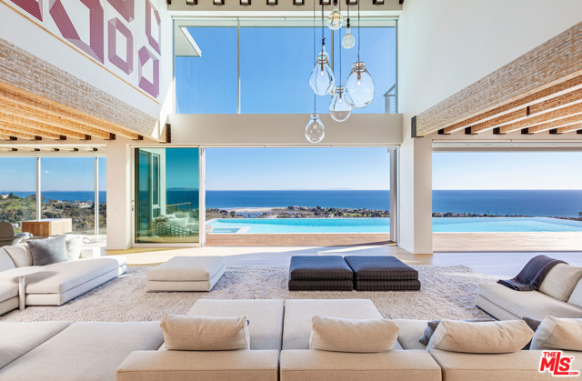 23800 Malibu Crest Drive Malibu, California An architectural triumph situated on one of Malibu's most spectacular promontories, this landmark, 3.4-acre estate showcases masterful craftsmanship and 360-degree ocean and canyons views. Featuring Scott Gillen design, The Castle has an 11,000-SF main residence, a guest house and extraordinary amenities. Pass the gates to the 400-ft private drive and expansive motor court. Inside, ocean views inspire from the glass-enclosed great room. A custom-designed Bulthaup kitchen and hand-hewn teak dining table beckon gourmet meals. Outside, a spa and infinity pool are perched on the horizon. A teak wine room, game room, media room, and home office offer abundant space for work and play. The primary bedroom has a spa-like bathroom with a rain shower, walnut soaking tub, and private terrace. The Castle is a work of art that will capture your imagination. Minutes from fine dining and shopping, experience a Malibu lifestyle that is nothing short of extraordinary.